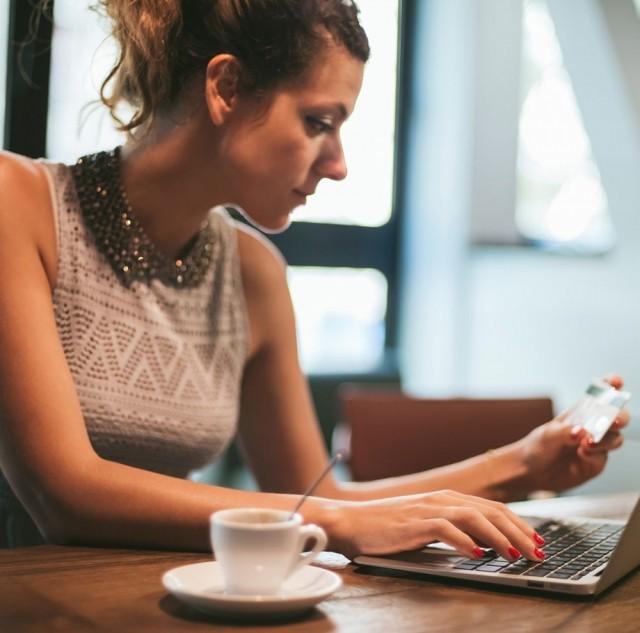 Woman at table with computer